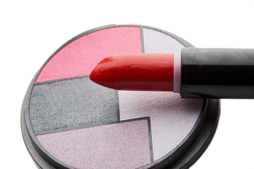 Red lipstick and palette of eye-shadows