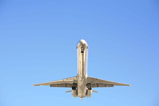 airplane against clear blue sky