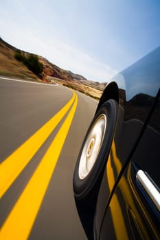 car driving through mountains