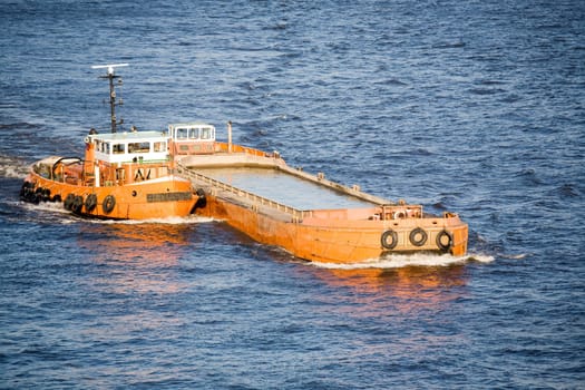 barge and tug on river