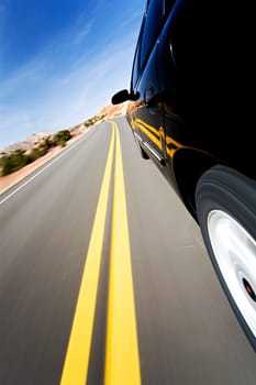 car driving on mountain road