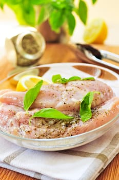 Raw chicken breasts marinating