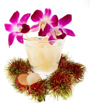 Rambutan with fruit juice and orchid