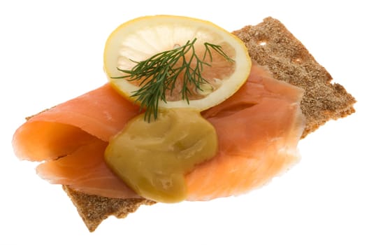 Salmon garnished on crispbread