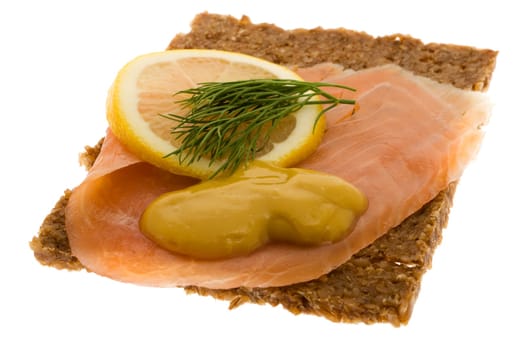 Salmon garnished on wholemeal bread