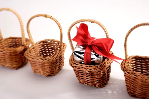 A gift box in a basket among baskets