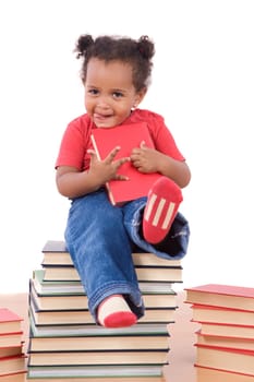 Baby sitting on a pile of books