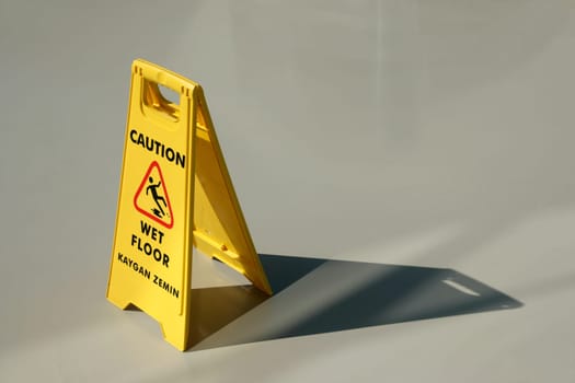 An image of yellow wet floor caution