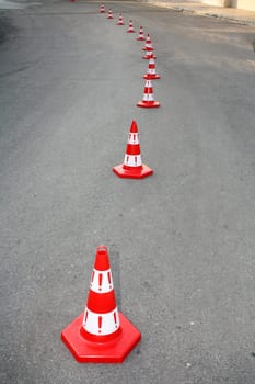 An image of cautions on asphalt road