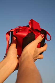 close up shot of black giftbox in hand