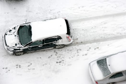 cars covered with snow in winter time