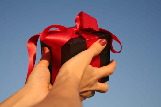 close up shot of black giftbox in hand