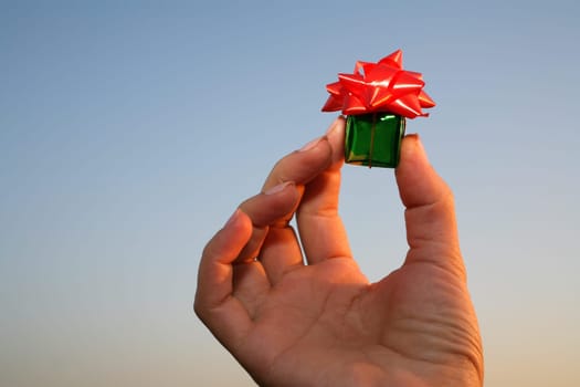 close up shot of green giftbox in hand