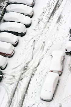cars covered with snow in winter time