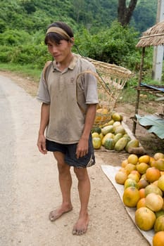 Hmong man in Laos with butte