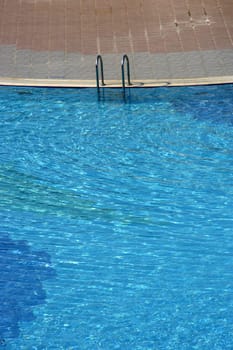 blue swimming pool in summer