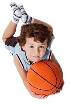 Beautiful boy playing basketball