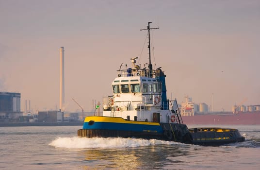 Tug passing by in the sun
