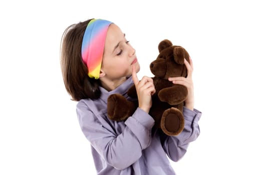 Pretty girl scolding teddy bear
