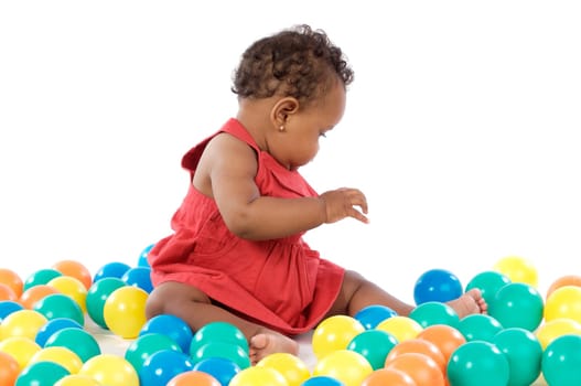 Baby with balls