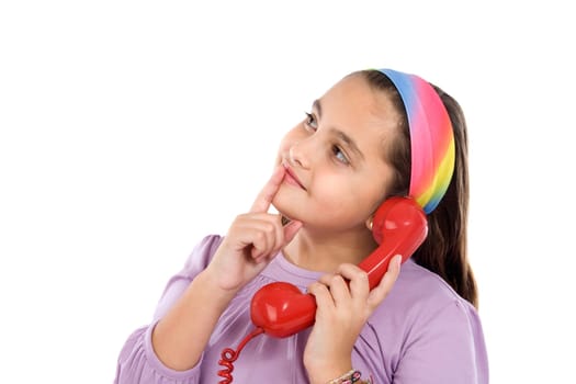 Beautiful girl with red phone thinking