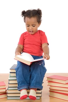 Baby reading sitting on a pile of books