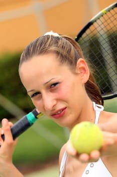 Woman serving in tennis