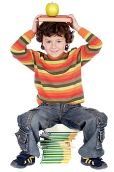 Adorable child studying with books and a