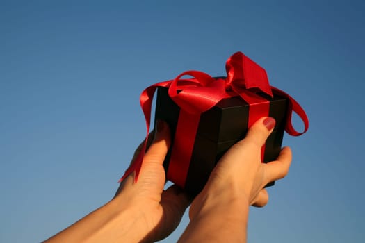 black giftbox in hand