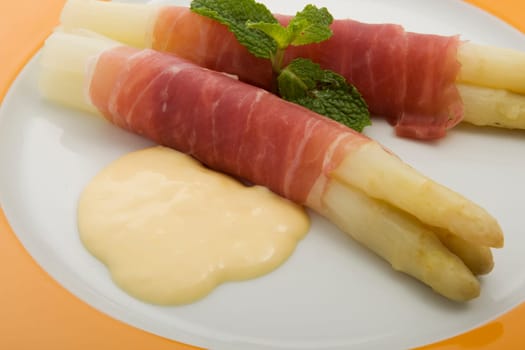 white asparagus with Parma ham and hollondaise sauce
