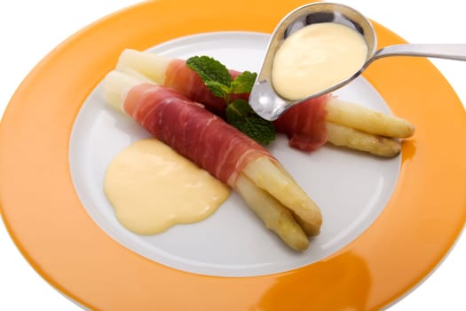white asparagus with Parma ham and hollondaise sauce