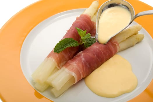 white asparagus with Parma ham and hollondaise sauce