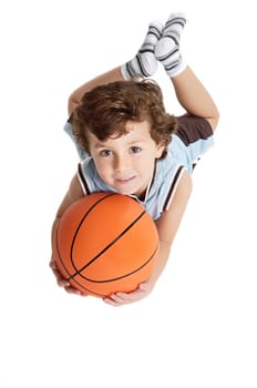 adorable boy playing the basketball