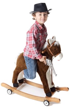 adorable kid riding a toy horse