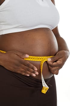 attractive pregnant woman with tape