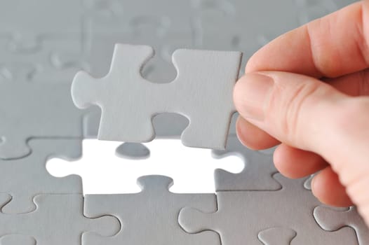 Puzzle and hand