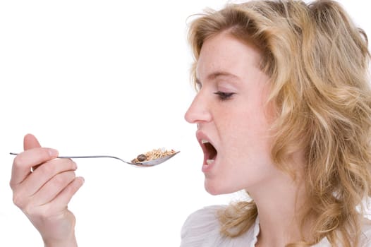 Young woman eating cereal