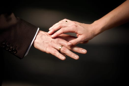Hand in hand with wedding ring