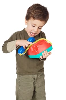 adorable boy speaking on the telephone