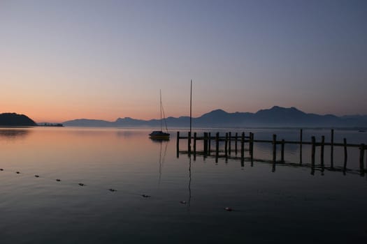 Chiemsee at sunrise in front of the Alps