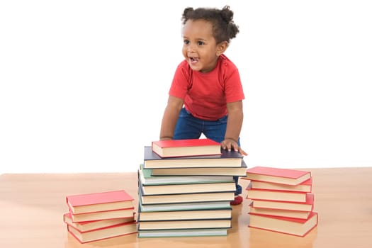 Adorable african baby with many books