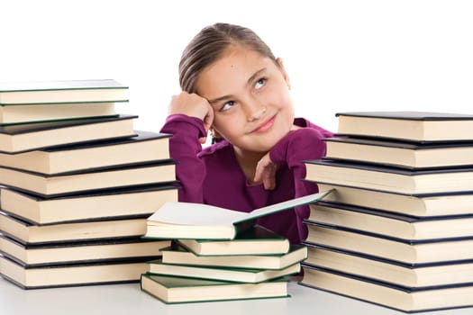 Adorable girl with many books thinking