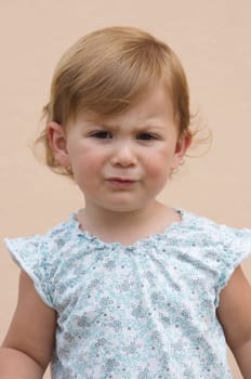 Beautiful girl frowning with funny