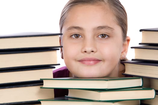 Adorable girl concentrated with books