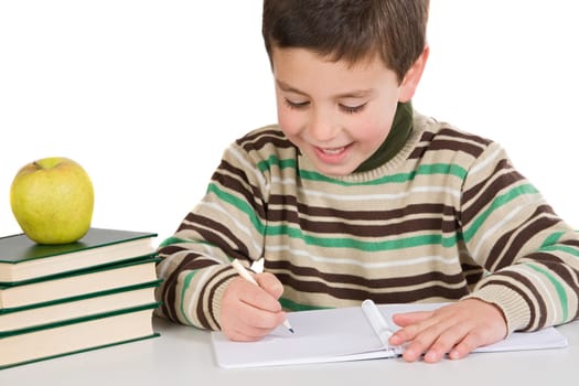 Adorable child writing in the school