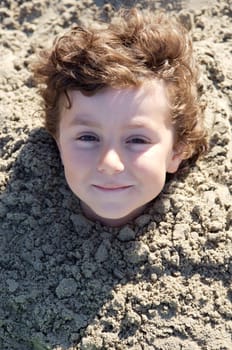 Child buried in the sand