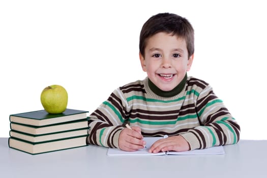 Adorable child writing in the school