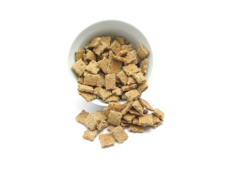 Selfmade dog cookies out of a bowl of chinaware