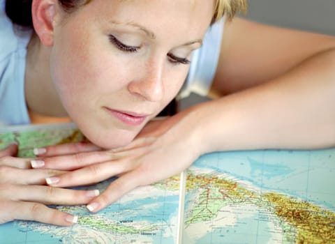 Young girl is reading a map