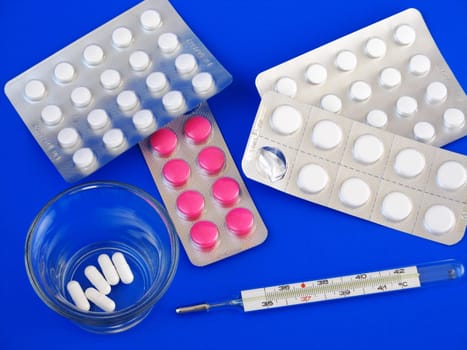 medical pills and thermometer - detail